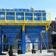 Camfil Gold Series modular cartridge dust collector installed outdoors with maintenance walkway. Camfil Gold Series modular cartridge dust collector installed outdoors with maintenance walkway.