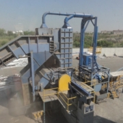 Large industrial metal shredder with integrated dust extraction ductwork. Large industrial metal shredder with integrated dust extraction ductwork.