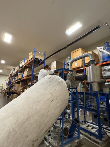 A member of our engineering team performing dust testing on a customer sample.